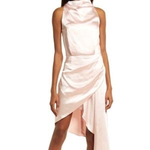 ALAIA ASYMMETRIC SATIN COCKTAIL DRESS IN BLUSH An asymmetric hemline, gathered w